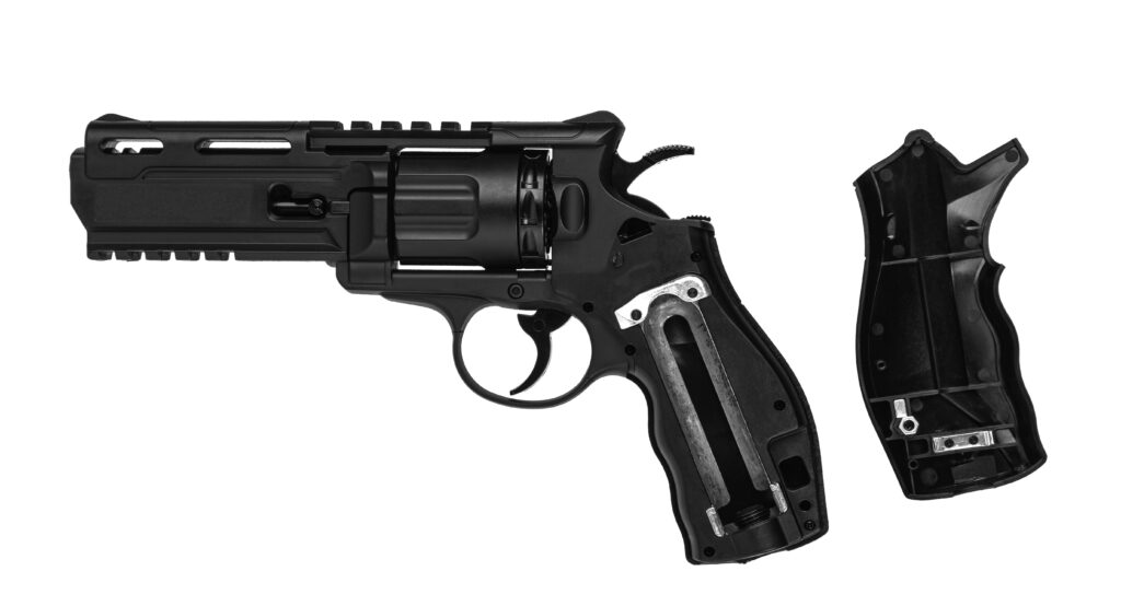 Pistolet de défense CO₂ avec poignée ouverte montrant l’emplacement de la cartouche de CO
